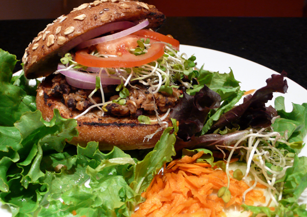 flore burger: black bean burger grilled and served with sliced tomato, sprouts, red onion, green leaf lettuce and thousand island dressing. served with a side salad. $9.95