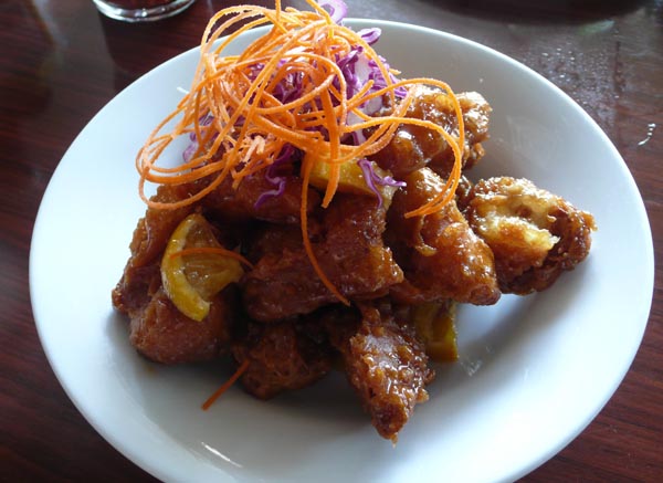 orange chicken: soy chicken lightly battered and marinated with orange sauce. $10.95 (served with steamed brown rice)