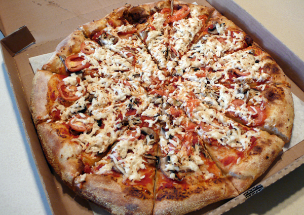 large pizza with vegan mozz, mushrooms, tomatoes and chopped garlic on micro-brew crust. $21.39