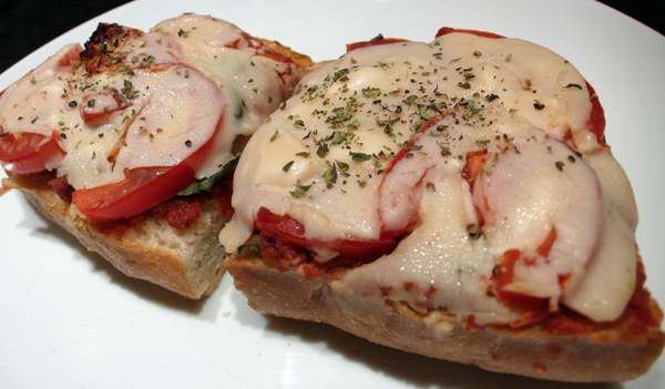 french bread pizza: tomato and basil. $6.95
