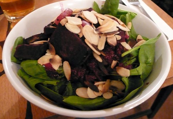 grilled beet salad: fire grilled beets and onions over a bed of fresh spinach, topped with our homemade orange-beet dressing, and toasted almonds. $10