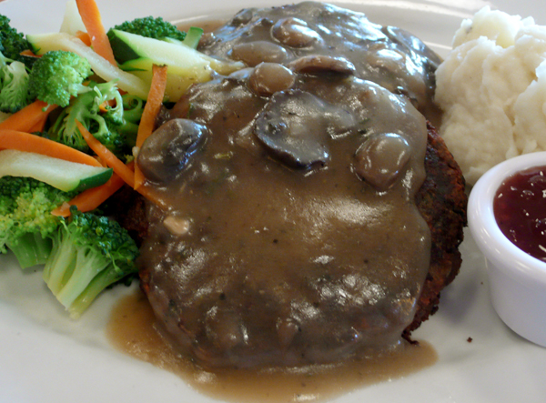 happy happy holiday feast: two new american veggie patties, with vegan, gluten-free mushroom gravy. served with mixed seasonal vegetables, cranberry sauce and mashed potatoes. $13.75