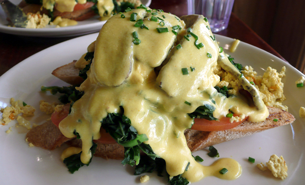 vegan benedict: grilled whole-grain baguette steamed kale, tomato, tempeh bacon with soy hollandaise. $10.25