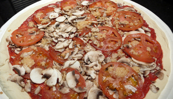 large pizza with no cheese, mushroom, garlic and tomatoes. $18.49