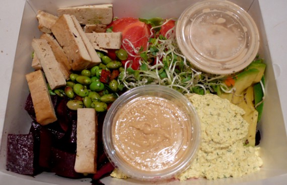 the salad: Bed of mixed baby greens topped with portions of tofu egg salad, shredded carrot, baked tofu, roasted beets, edamame salad, tomato, avocado and daikon sprouts. Served with a side of hummus and choice of thousand island, miso, vinaigrette or tahini dressing. $9.95