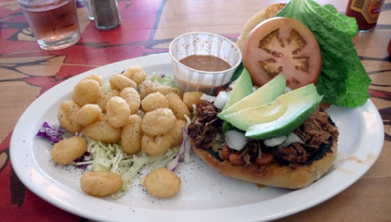 torta: sauteed jackfruit "carnitas", plus pinto beans, lettuce, tomato, onions, tomatillo salsa, sliced avocado and vegan mayo on a grilled rustic roll. with a side of potato pals. $9