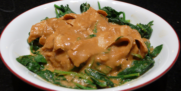 praram's plate: marinated soy chicken pan-fried with peanut sauce on a bed of steamed spinach. $9.95