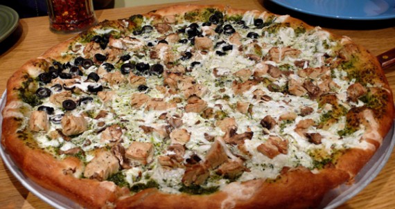 vegan purgatory pizza with teese cheese, gardein chicken, pesto, mushrooms and (1/2) olives