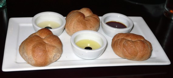 bread and olive oil: cold pressed california extra virgin olive oil with balsamic reduction and home made wheat rolls. $5