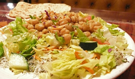 yogi's delight: indo-American combination bringing you chickpeas curry on a bed of beans and sprouts, topped with onions, tomatoes, cucumber, and other vegetables, plus paratha. $12.95