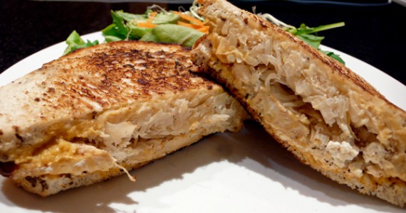 tempeh reuben: grilled reuben sandwich served on organic corn rye with layers of tofu cheese, cashew cheese, tempeh, sauerkraut and thousand island dressing. served with your choice of side. $9.95