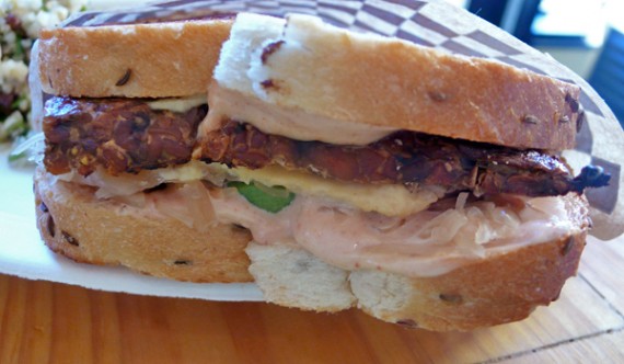 Love Reuben: Savory marinated tempeh with house-made Swiss, sauerkraut & avocado with Russian dressing on rye. $11.95
