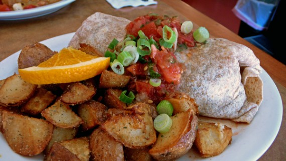 vegan fiesta burrito: a blend of seasoned vegetables, tofu, house chili wrapped in a wheat tortilla topped with salsa and green onions. served with seasoned red potatoes. $8.95