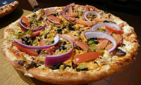 vegan chicken taco pizza: daiya cheddar cheese, gardein chicken, jalapenos, black olives, tomatoes, red onions. 