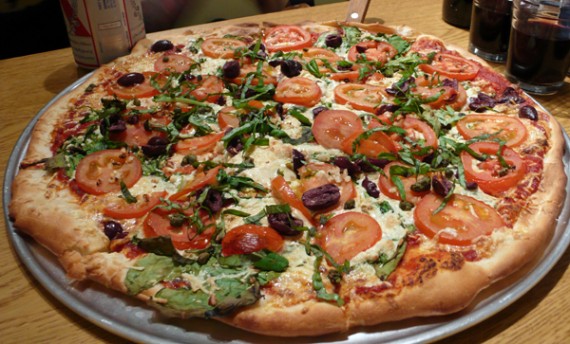 vegan pizza: daiya cheese, kalamata olives, fresh basil and tomatoes. 