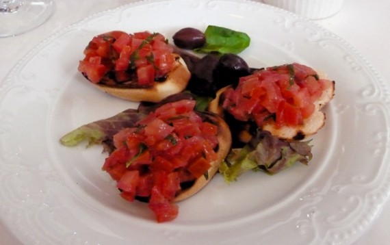 bruschetta classica: toasted bread, fresh tomatoes, basil and extra virgin olive oil.