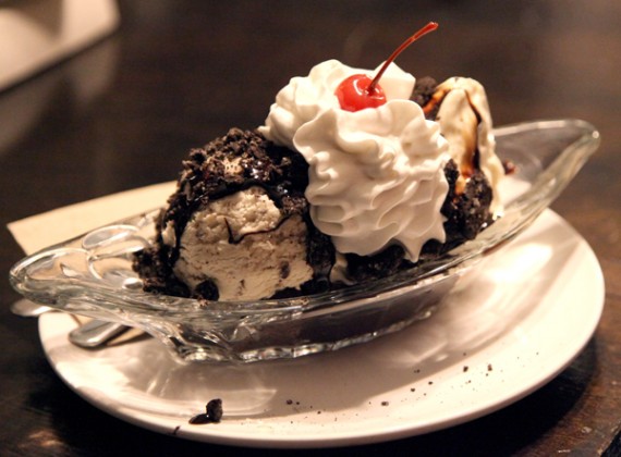 brownie sundae: 2 scoops or soft serve + 1 sauce + 1 topping. topped with w...